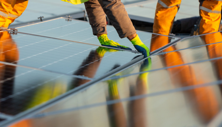 Solar panels being installed on a roof