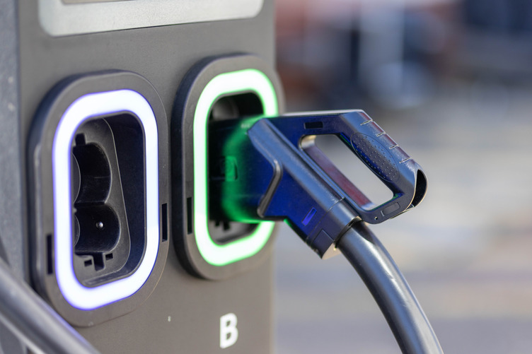 An electric vehicle being charged