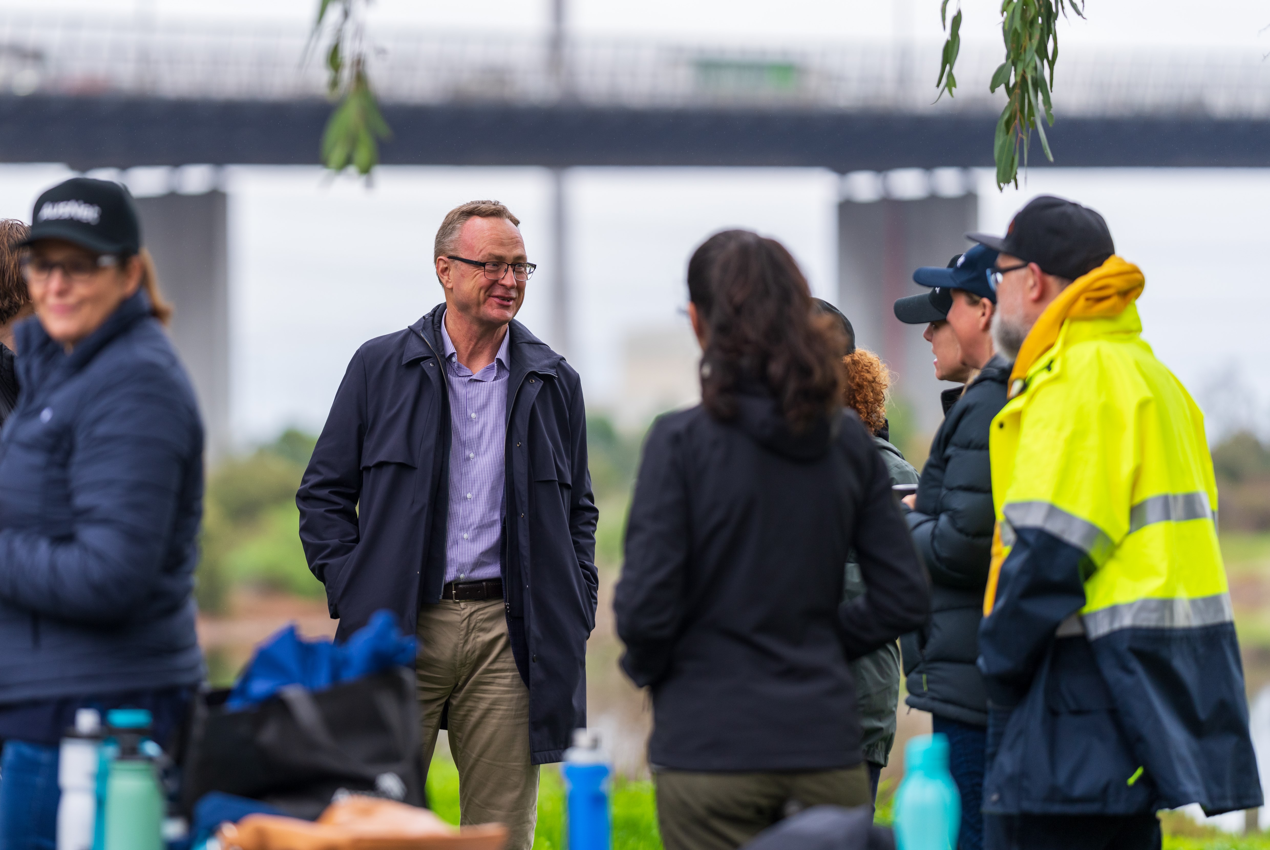 A group of people talking outside