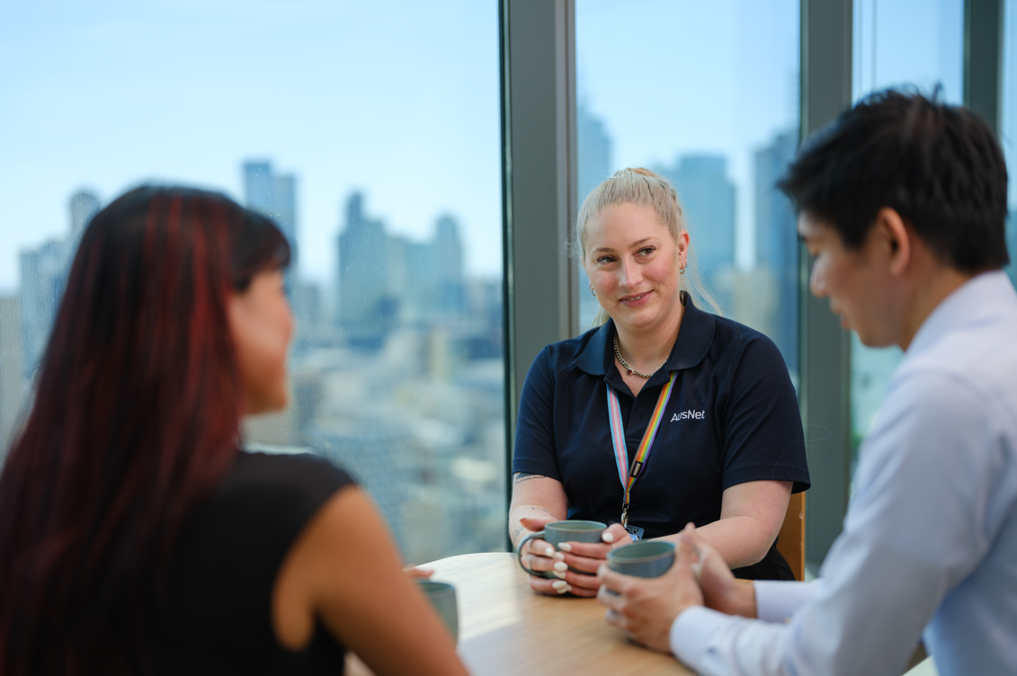 A group of people sitting together at a table