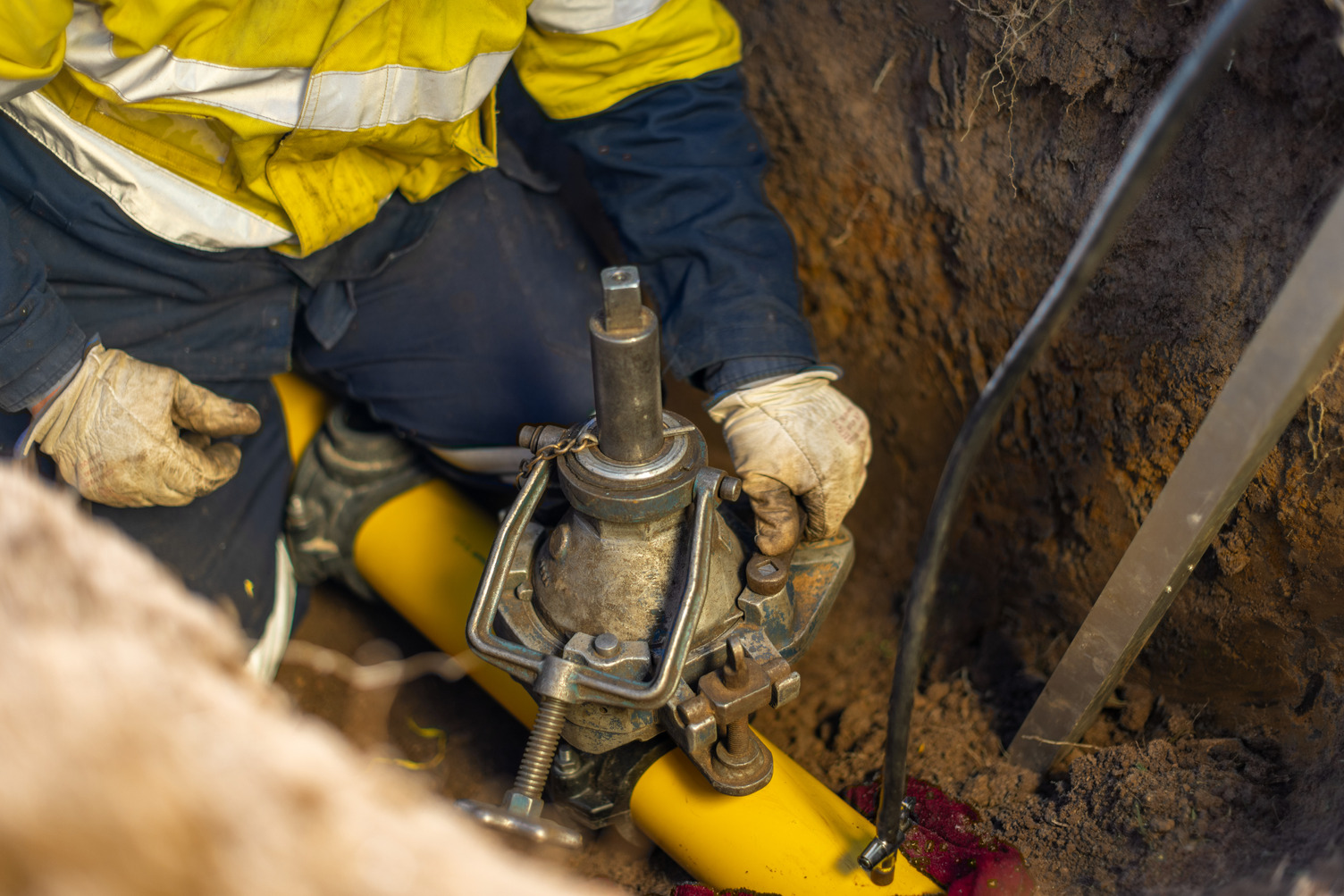 A person working on a gas valve
