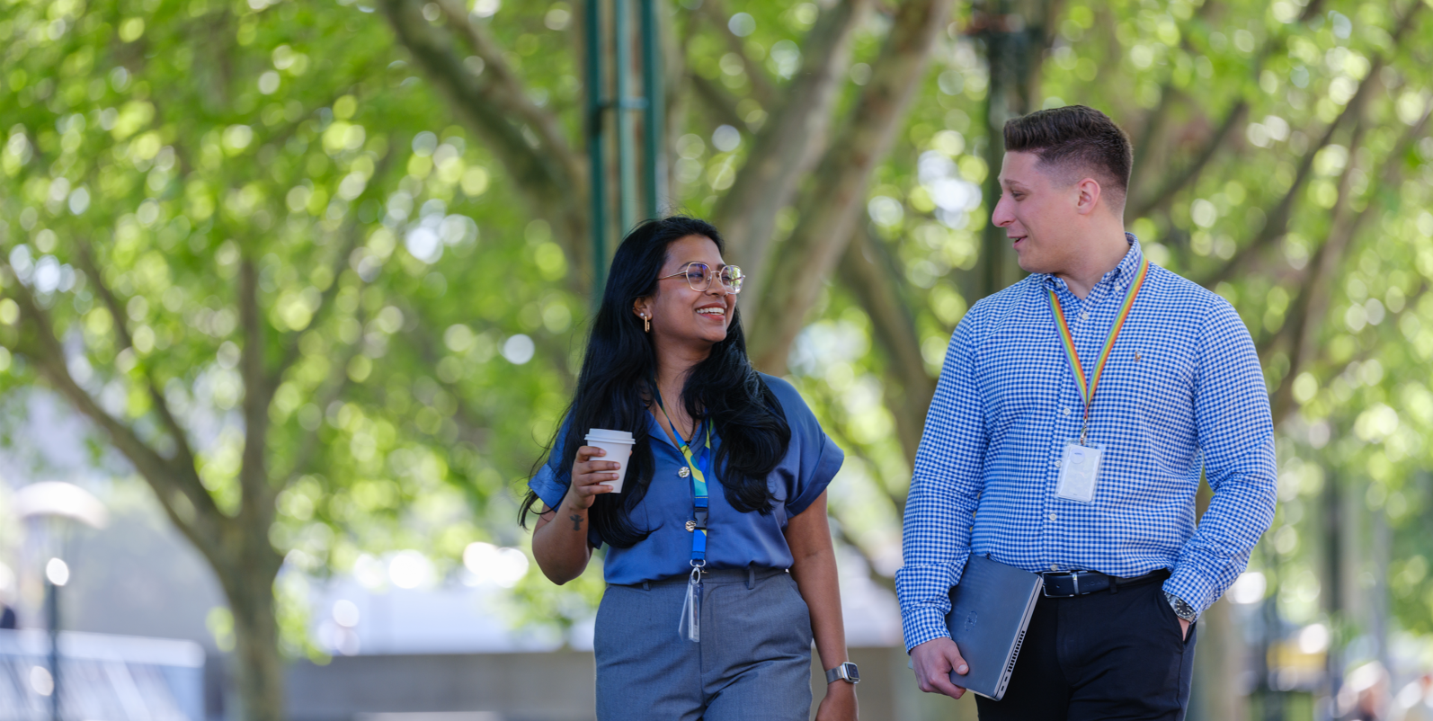A man and woman walking outside together 