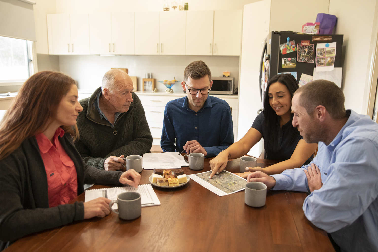A group of people sitting together at a table