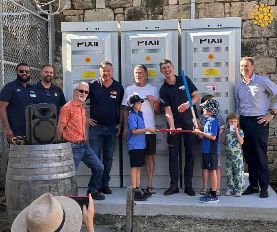 People standing in front of battery